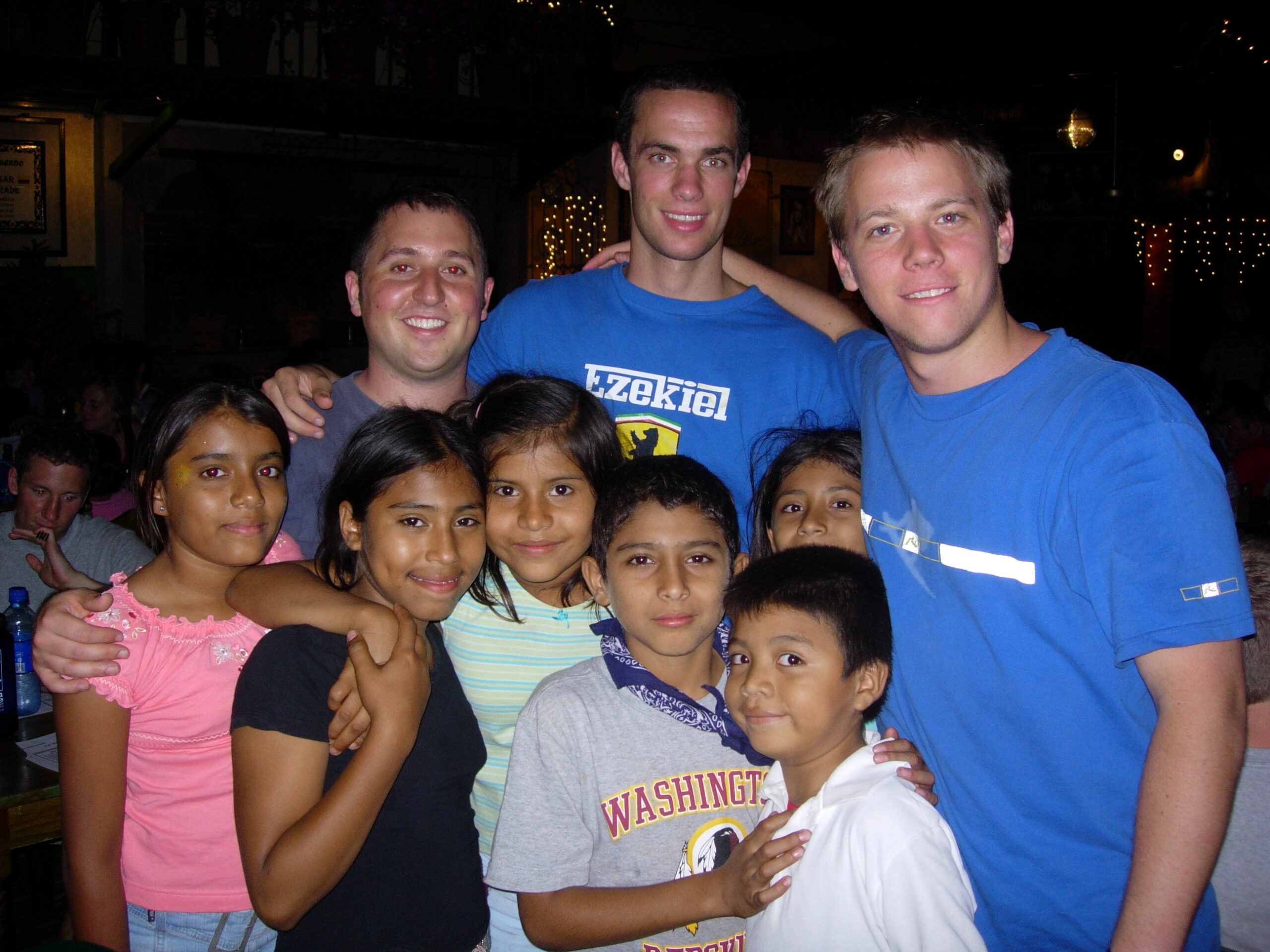 group of nicaraguan children posing with young missionaries