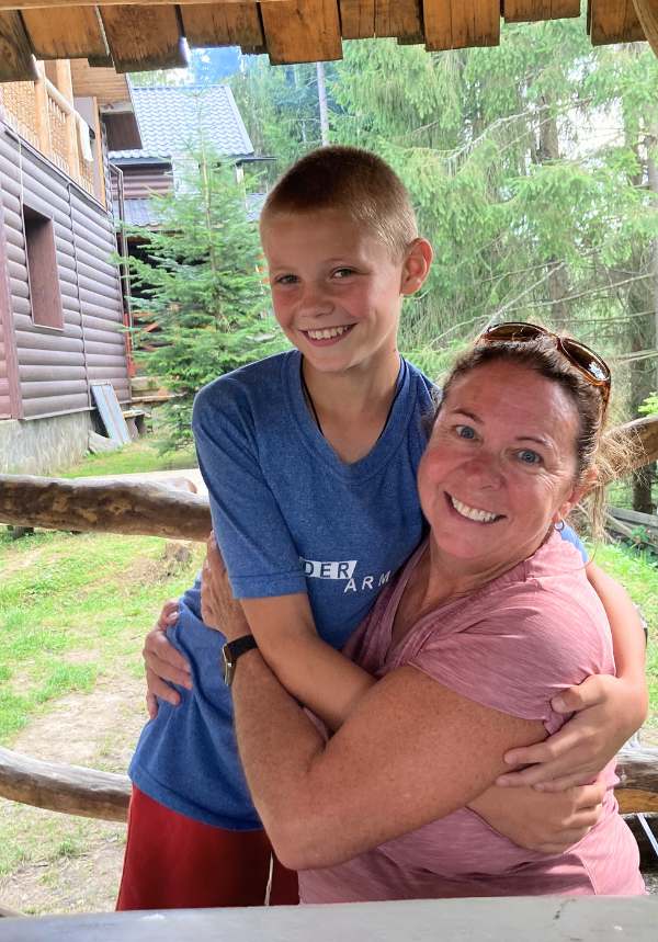 Volunteer and Ukrainian boy at Frontier Horizon's Camp Dreamland 2023