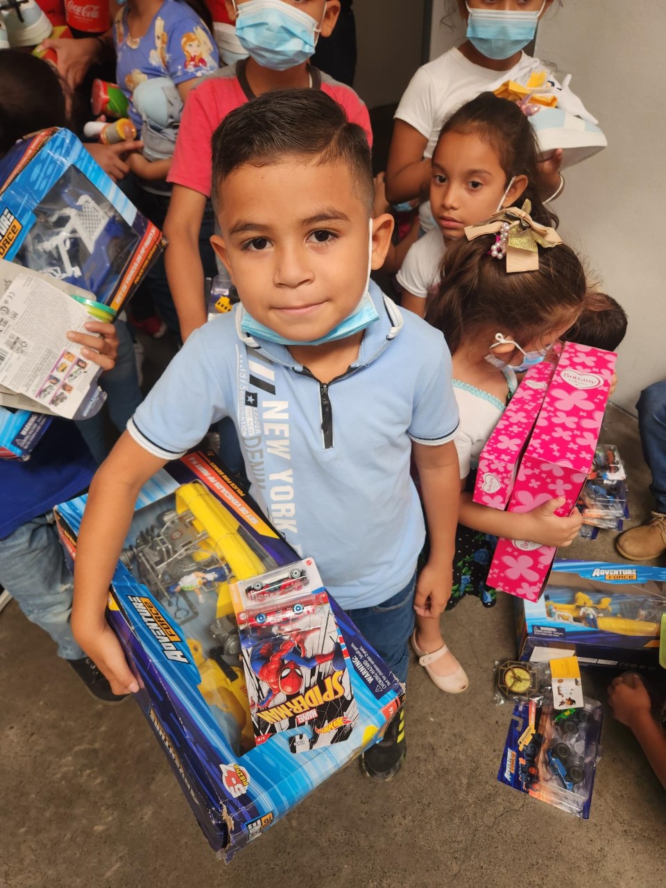 Young Nicaraguan boy celebrating a generously donated Christmas gift